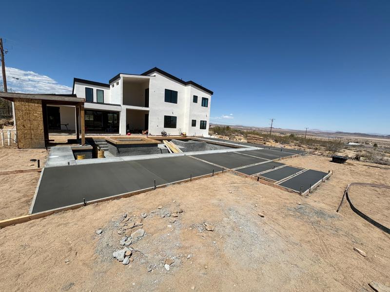 Pool deck and patio pour by Dig Deep Concrete